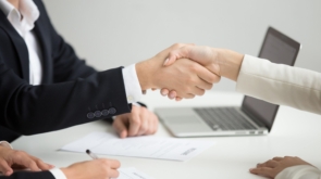 hr-handshaking-successful-candidate-getting-hired-new-job-closeup-2-min